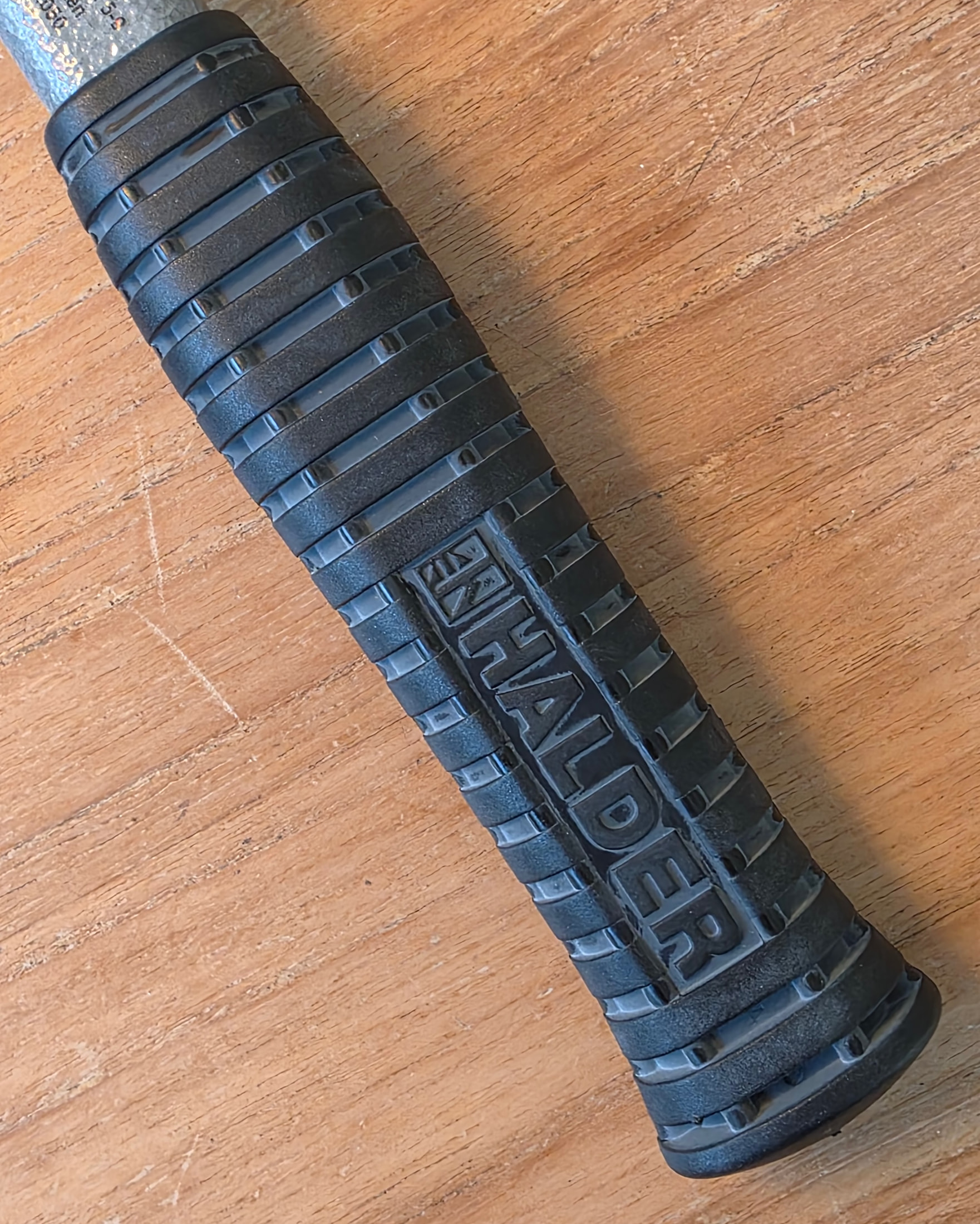 Ribbed black rubber grip on the HALDER SUPERCRAFT mallet, photographed away from the job site