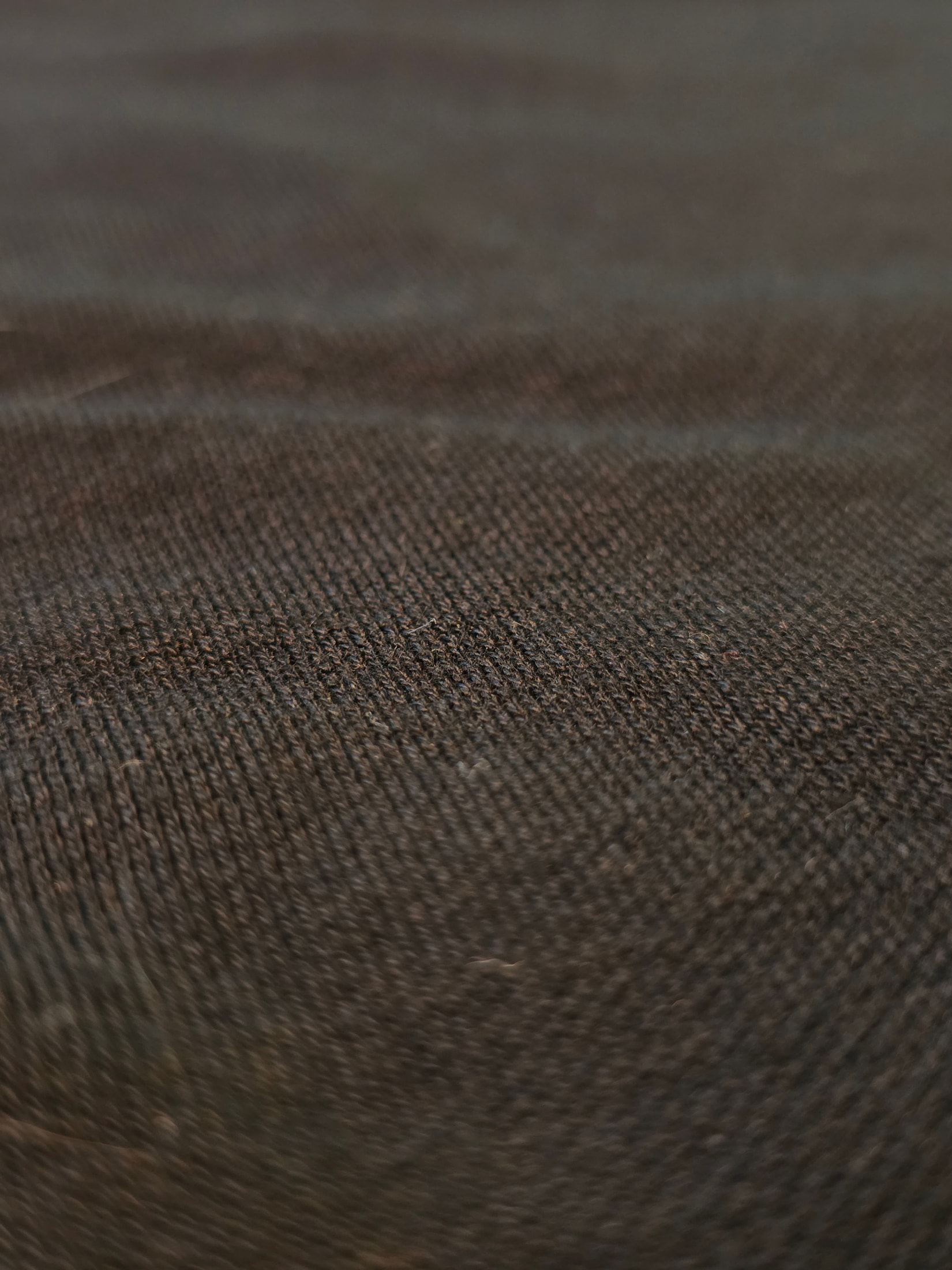 Trama della maglia nera della calzamaglia Ilkott in macro, con una cucitura verticale