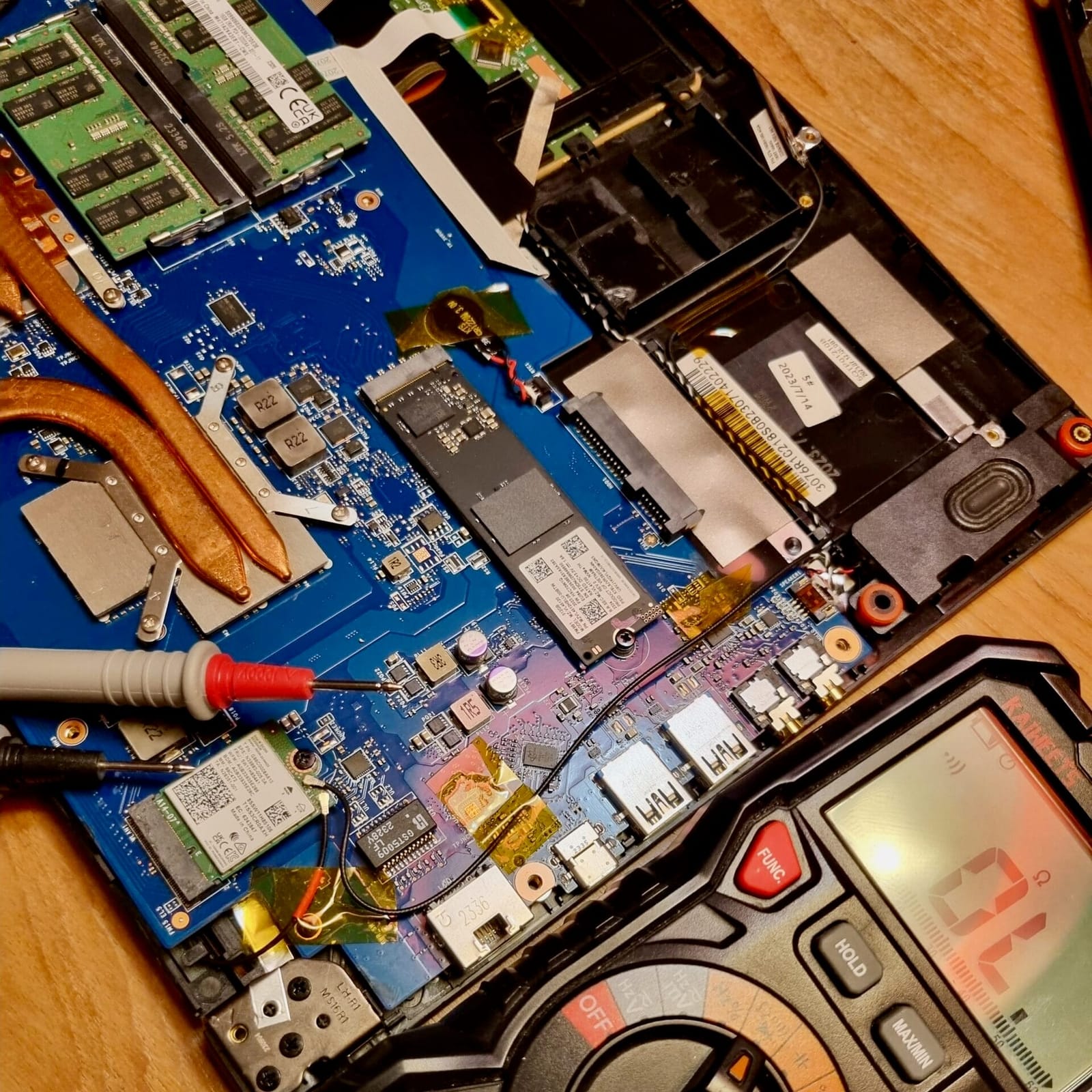 Multimeter probes connected to an electronic controller board