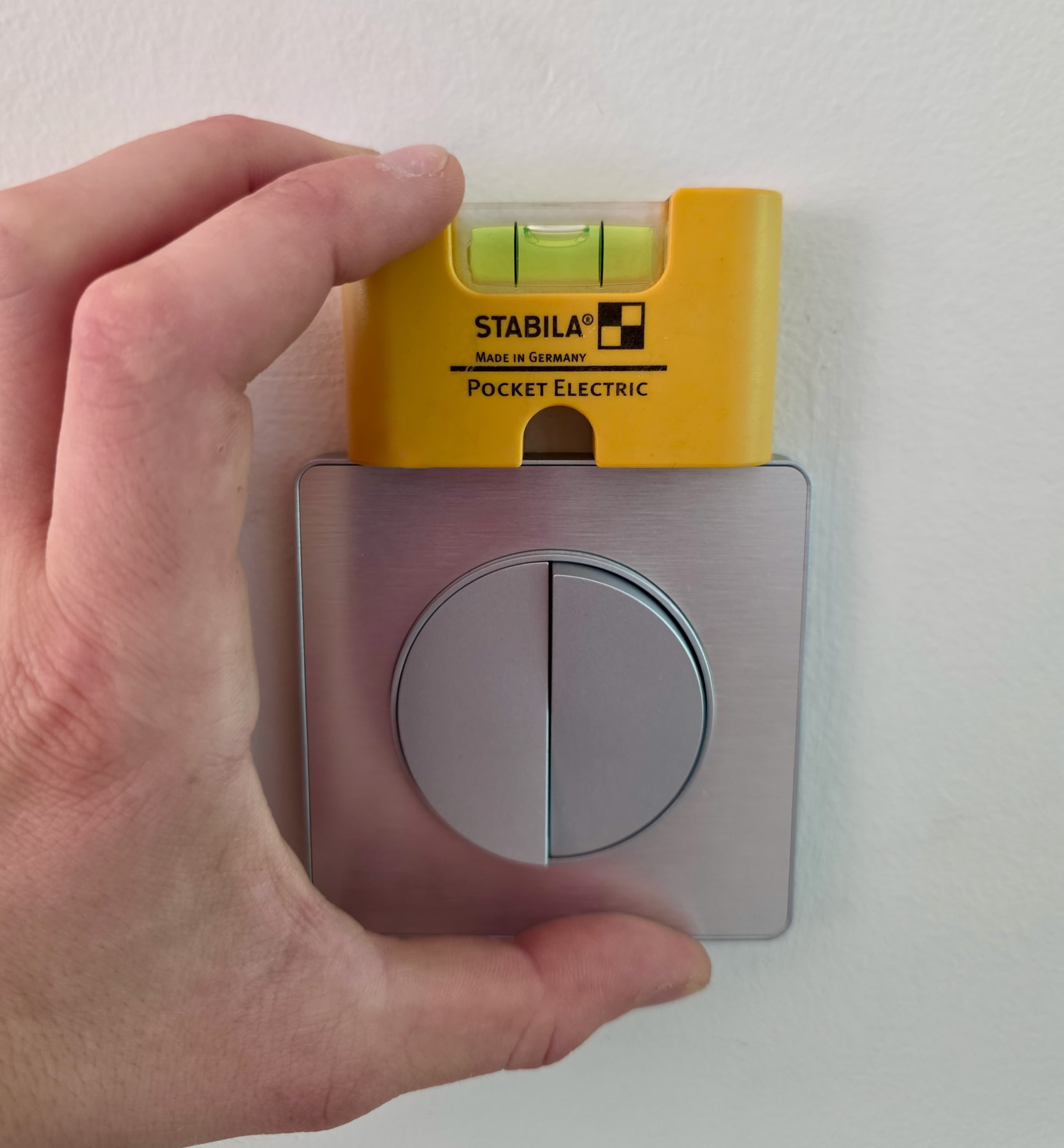 Stabila magnetic mini level placed on a socket to level it